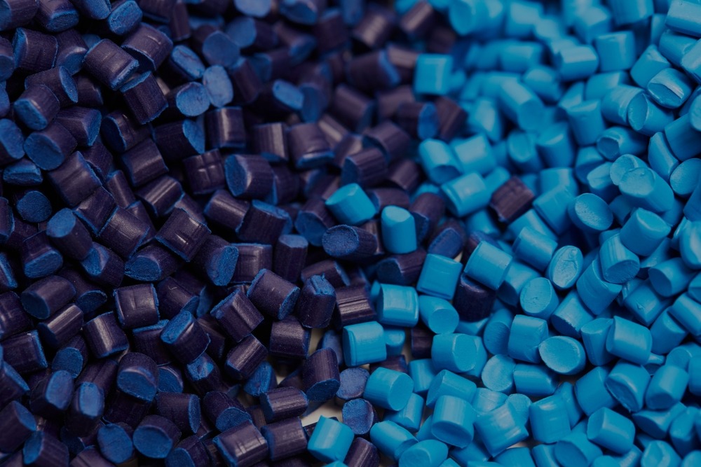 Plastic manufacturing worker operating machinery